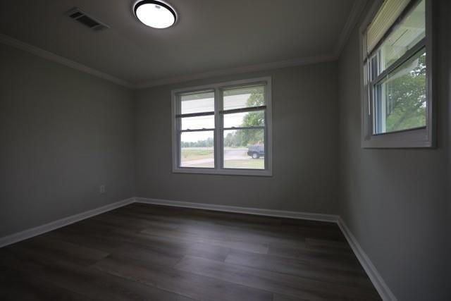 4006 North Arnold Mill Road Woodstock, GA 30188 - Photo 12 of 18 an empty room with wooden floor and windows