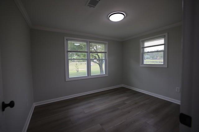 4006 North Arnold Mill Road Woodstock, GA 30188 - Photo 6 of 18 an empty room with wooden floor and windows