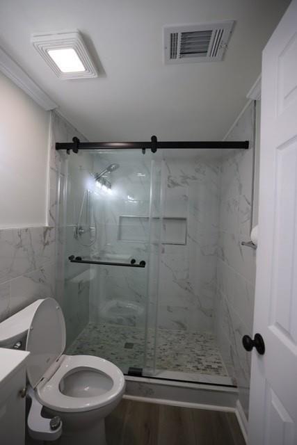 4006 North Arnold Mill Road Woodstock, GA 30188 - Photo 10 of 18 a bathroom with a toilet and a shower