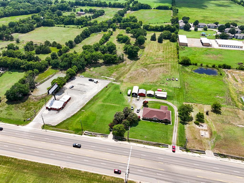 1709 Highway 121 Bonham, TX 75418 - Photo 5 of 19 an aerial view of a house with yard swimming pool and outdoor seating