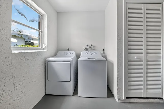 a utility room with dryer and washer