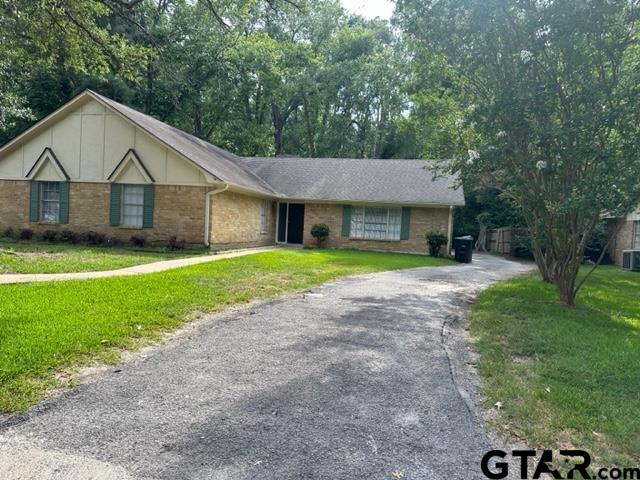 2611 South Boldt Avenue Tyler, TX 75701 - Photo 1 of 14 a view of a house with a yard and large tree