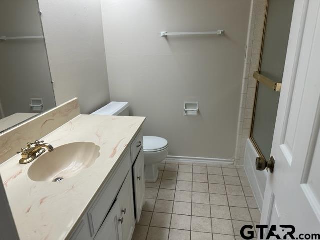 2611 South Boldt Avenue Tyler, TX 75701 - Photo 11 of 14 a bathroom with a sink toilet and shower