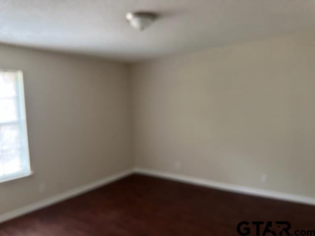 2611 South Boldt Avenue Tyler, TX 75701 - Photo 8 of 14 an empty room with a window