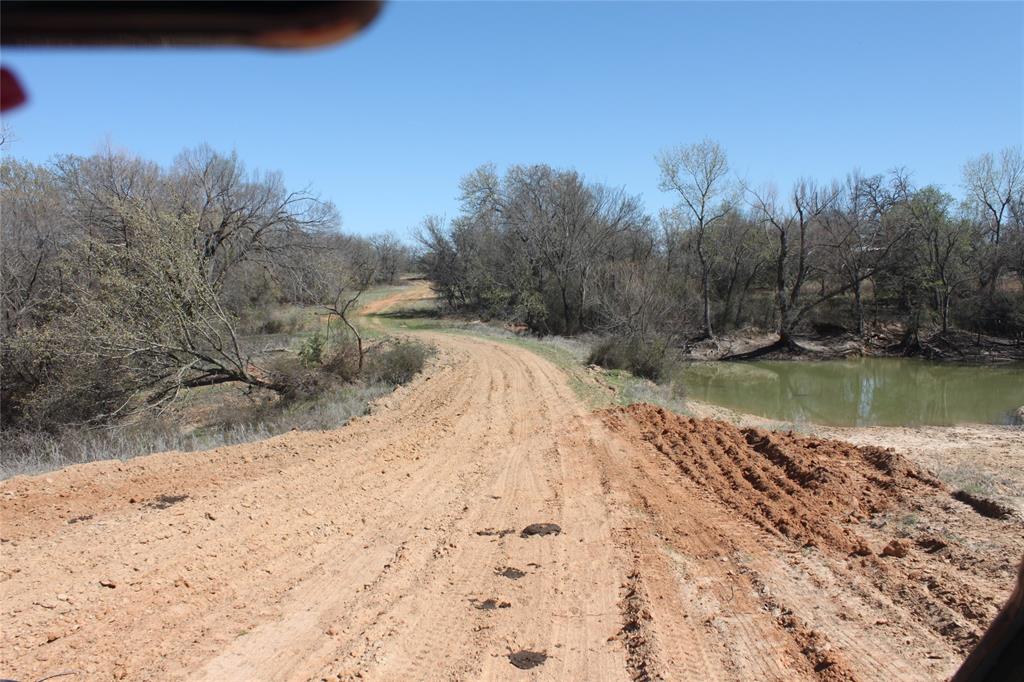 Undisclosed Address Springtown, TX 76082 - Photo 22 of 30 View of road featuring a water view