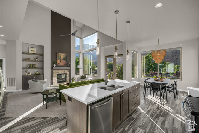 101 Chuckwalla Lane Springdale, UT 84767 - Photo 22 of 51 Kitchen with stainless steel dishwasher, electric range, a fireplace, recessed lighting, and decorative light fixtures