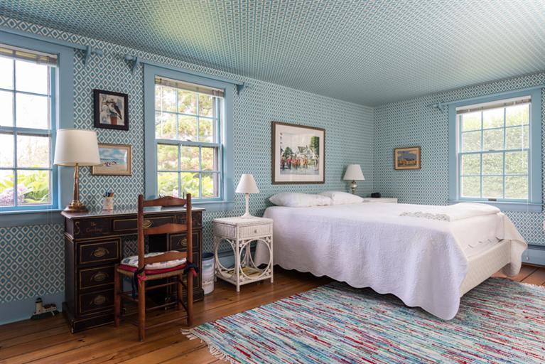157 Shore Road Chatham, MA 02633 - Photo 11 of 11 a bedroom with a bed table chair and a window