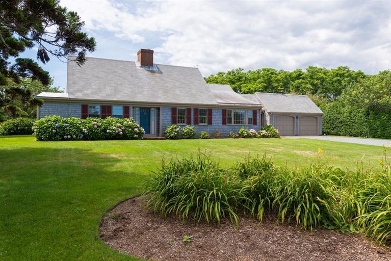 157 Shore Road Chatham, MA 02633 - Photo 4 of 11 a front view of a house with a garden
