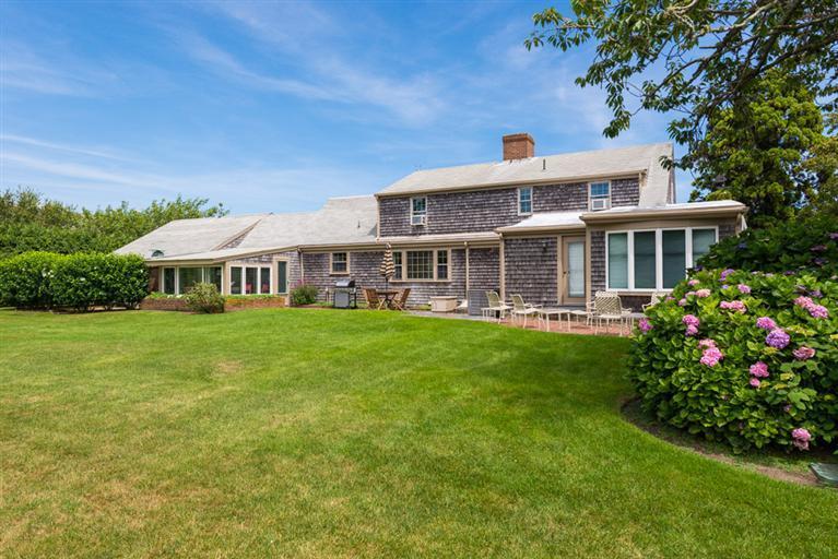 157 Shore Road Chatham, MA 02633 - Photo 5 of 11 a front view of house with yard and green space