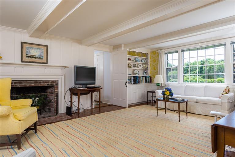 157 Shore Road Chatham, MA 02633 - Photo 9 of 11 a bedroom with a bed and a fireplace