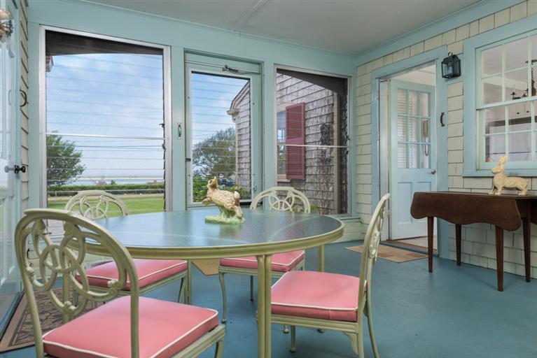 157 Shore Road Chatham, MA 02633 - Photo 10 of 11 a view of a dining room with furniture window and wooden floor