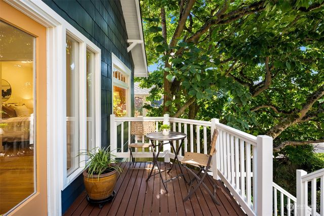 a view of balcony with furniture and wooden deck