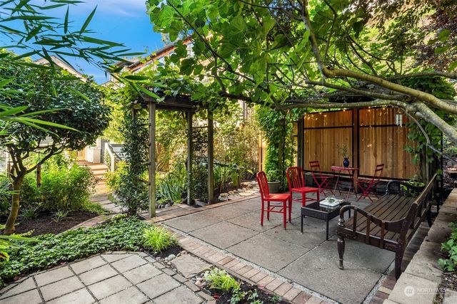 a view of yard with patio