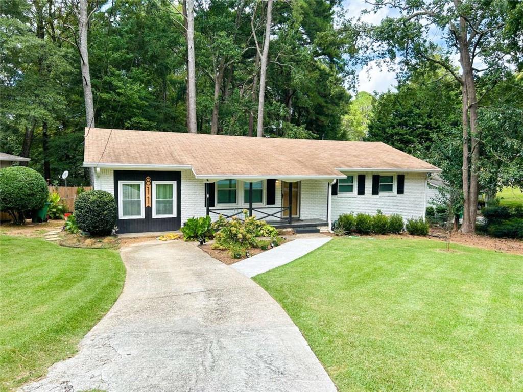 811 Cinderella Way Decatur, GA 30033 - Photo 1 of 33 a front view of a house with yard and green space