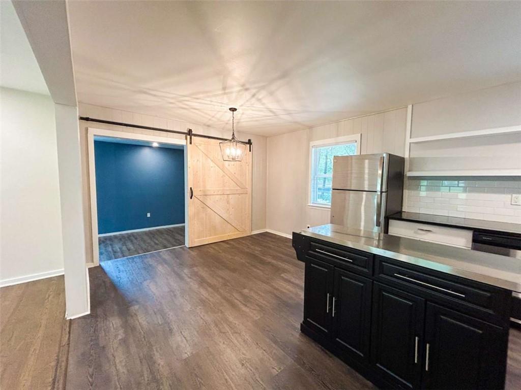 811 Cinderella Way Decatur, GA 30033 - Photo 11 of 33 a kitchen with stainless steel appliances granite countertop a refrigerator a sink and a stove