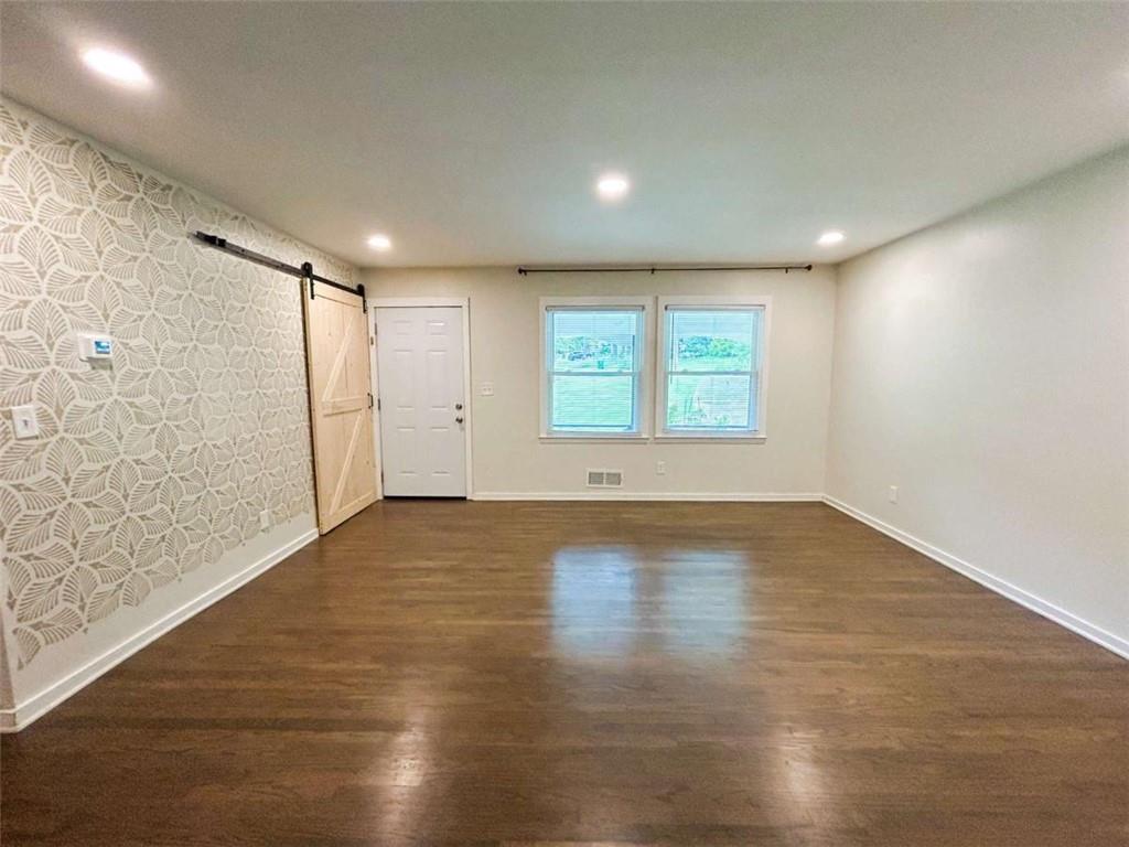 811 Cinderella Way Decatur, GA 30033 - Photo 13 of 33 an empty room with wooden floor and windows
