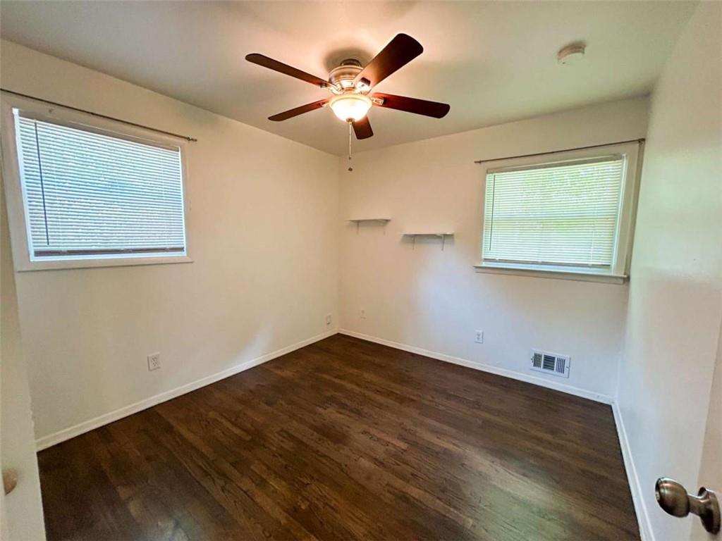 811 Cinderella Way Decatur, GA 30033 - Photo 17 of 33 a view of an empty room with window and wooden floor