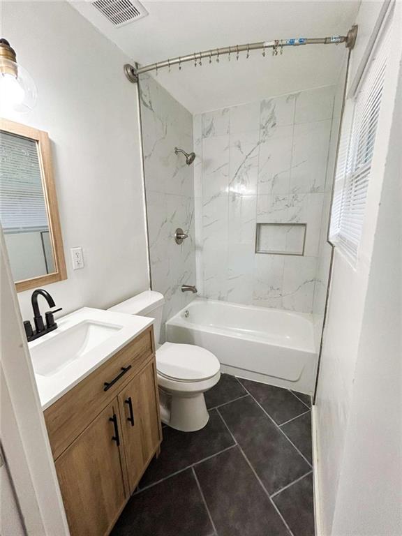 811 Cinderella Way Decatur, GA 30033 - Photo 19 of 33 a bathroom with a sink toilet vanity and shower