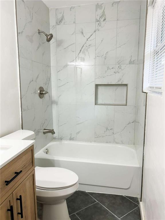 811 Cinderella Way Decatur, GA 30033 - Photo 20 of 33 a bathroom with a sink toilet and shower