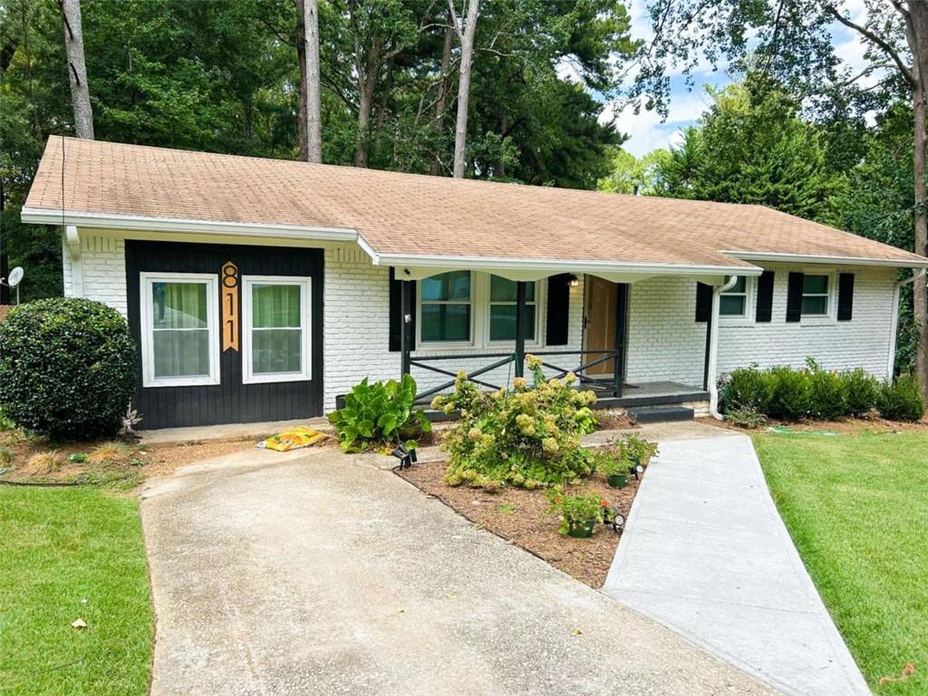 811 Cinderella Way Decatur, GA 30033 - Photo 2 of 33 a front view of a house with garden