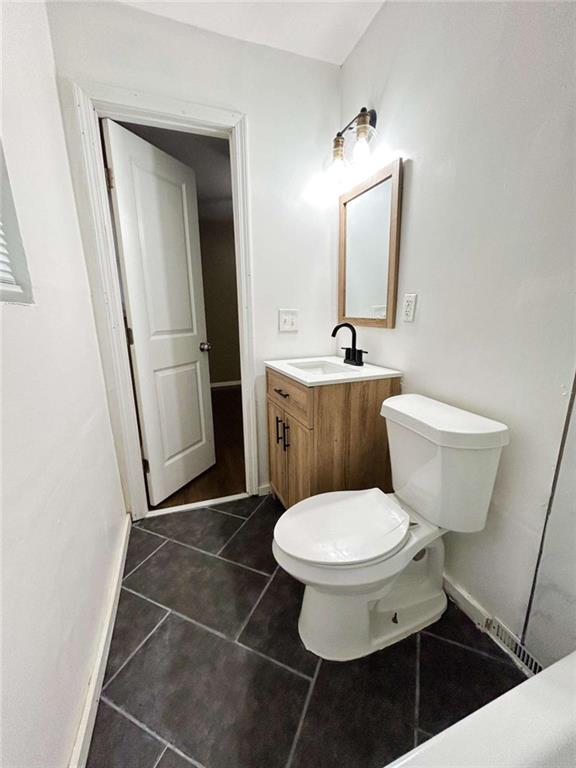 811 Cinderella Way Decatur, GA 30033 - Photo 22 of 33 a bathroom with a toilet and a sink