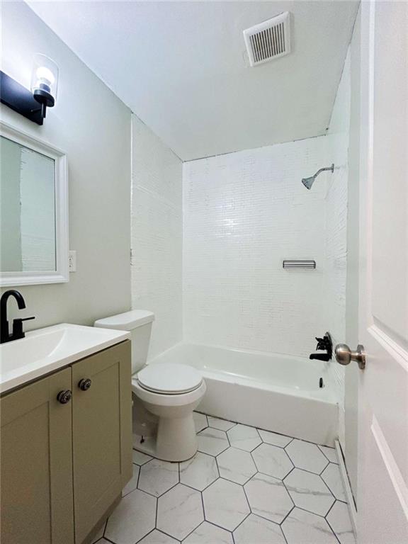 811 Cinderella Way Decatur, GA 30033 - Photo 23 of 33 a bathroom with a sink a toilet and shower