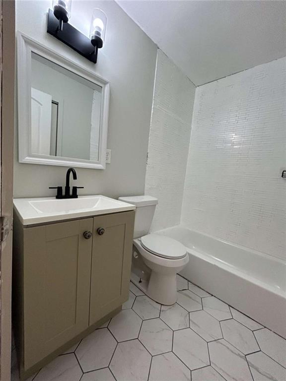 811 Cinderella Way Decatur, GA 30033 - Photo 24 of 33 a bathroom with a toilet sink and mirror