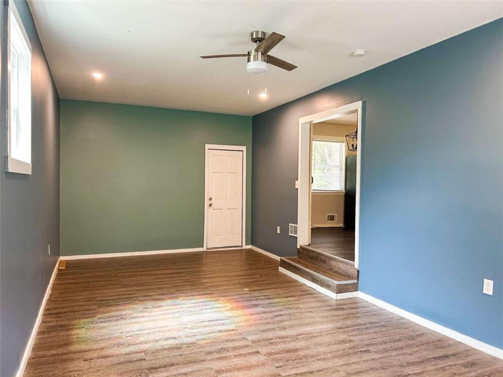 811 Cinderella Way Decatur, GA 30033 - Photo 28 of 33 a view of a livingroom with a chandelier fan and wooden floor