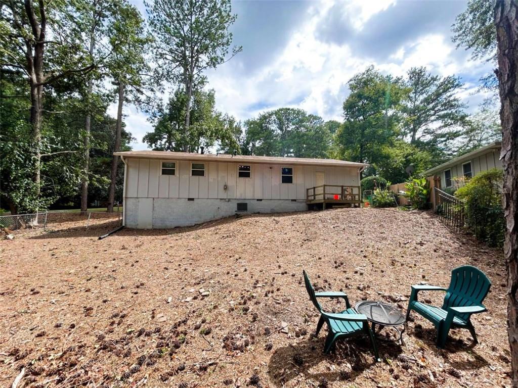 811 Cinderella Way Decatur, GA 30033 - Photo 30 of 33 a wooden bench sitting in the middle of a backyard