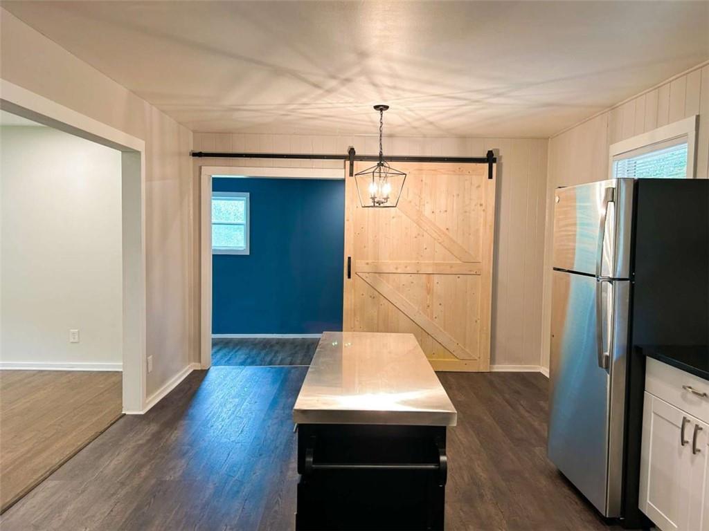 811 Cinderella Way Decatur, GA 30033 - Photo 10 of 33 a kitchen with a refrigerator a sink and wooden floor