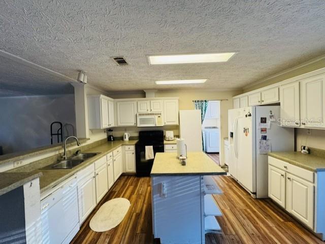 11817 Southwest 58th Street Webster, FL 33597 - Photo 6 of 46 a large kitchen with a lot of counter space and wooden floor