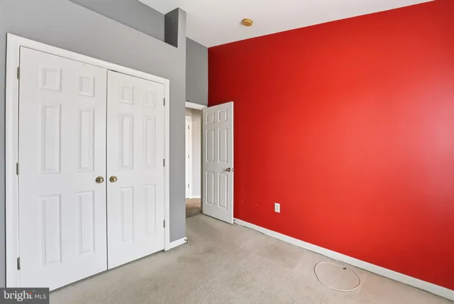 an empty room with a empty space and windows