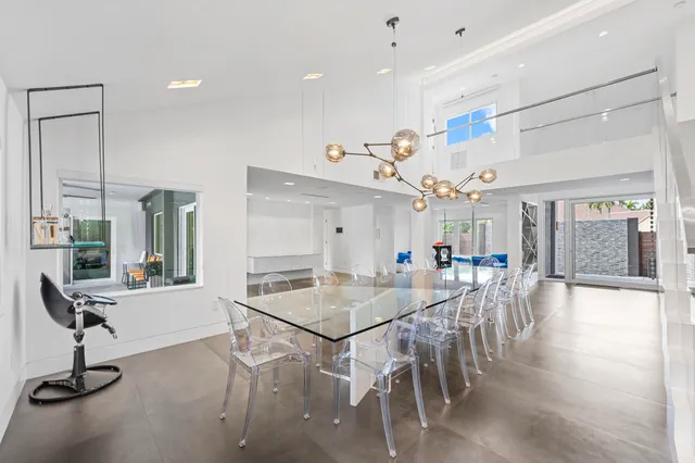 a bathroom with a bathtub sink vanity and mirror