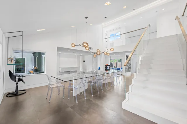 a bedroom with furniture and a large window