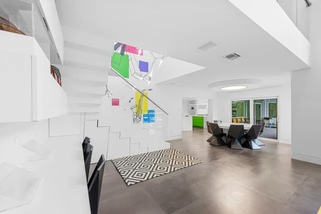 a bedroom with two beds and a couch