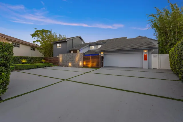 a front view of a house with yard