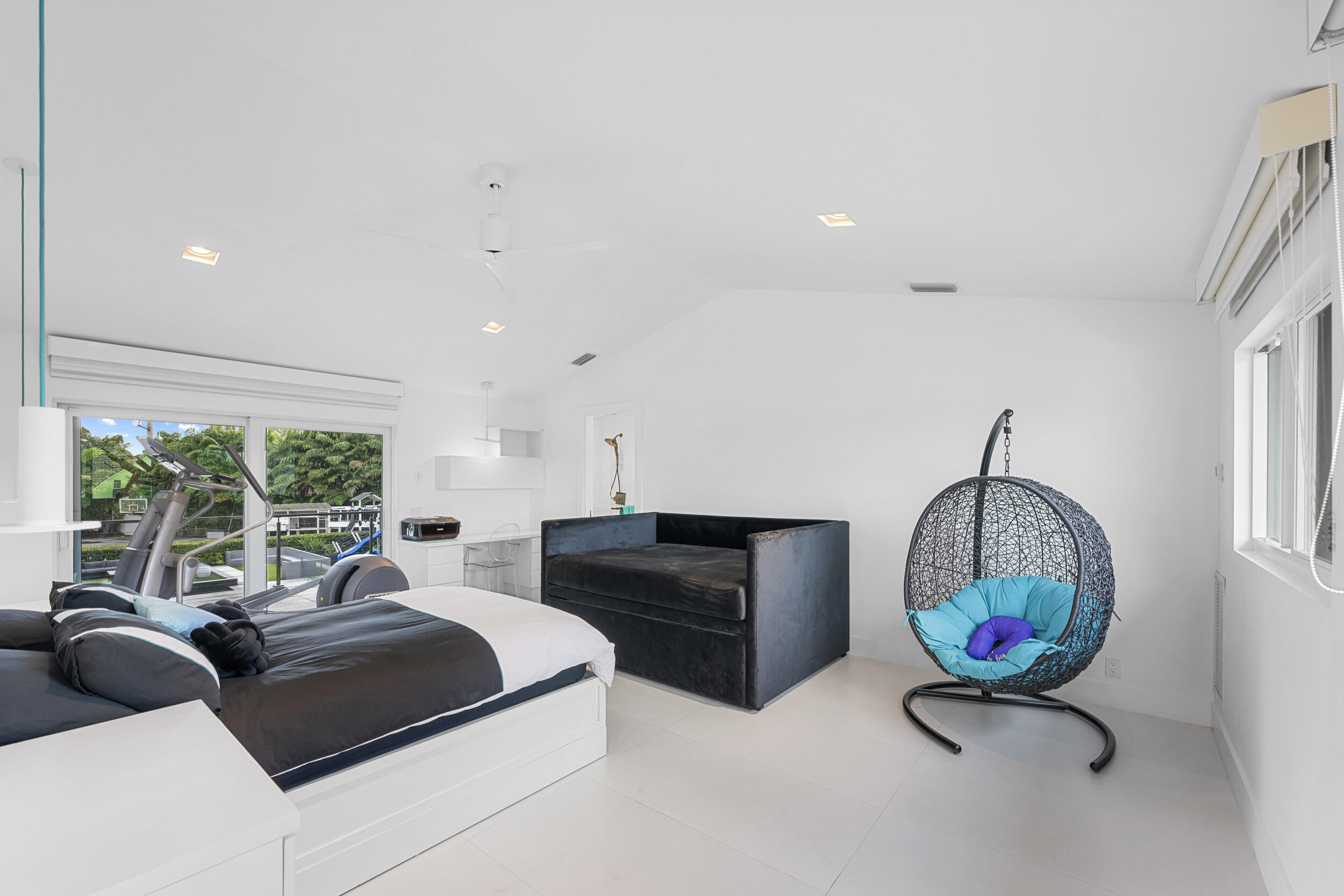 7047 San Sebastian Circle Boca Raton, FL 33433 - Photo 31 of 95 a living room with furniture a window and a chandelier