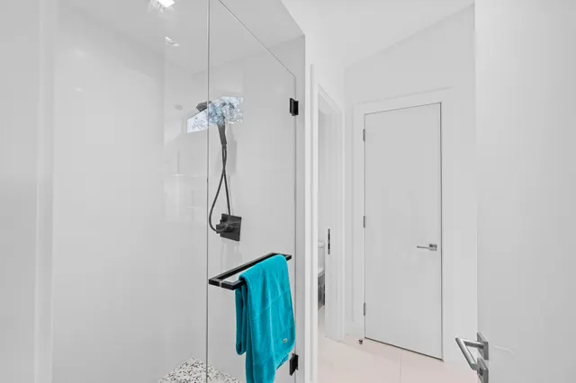 a view of a swimming pool with a patio and a yard