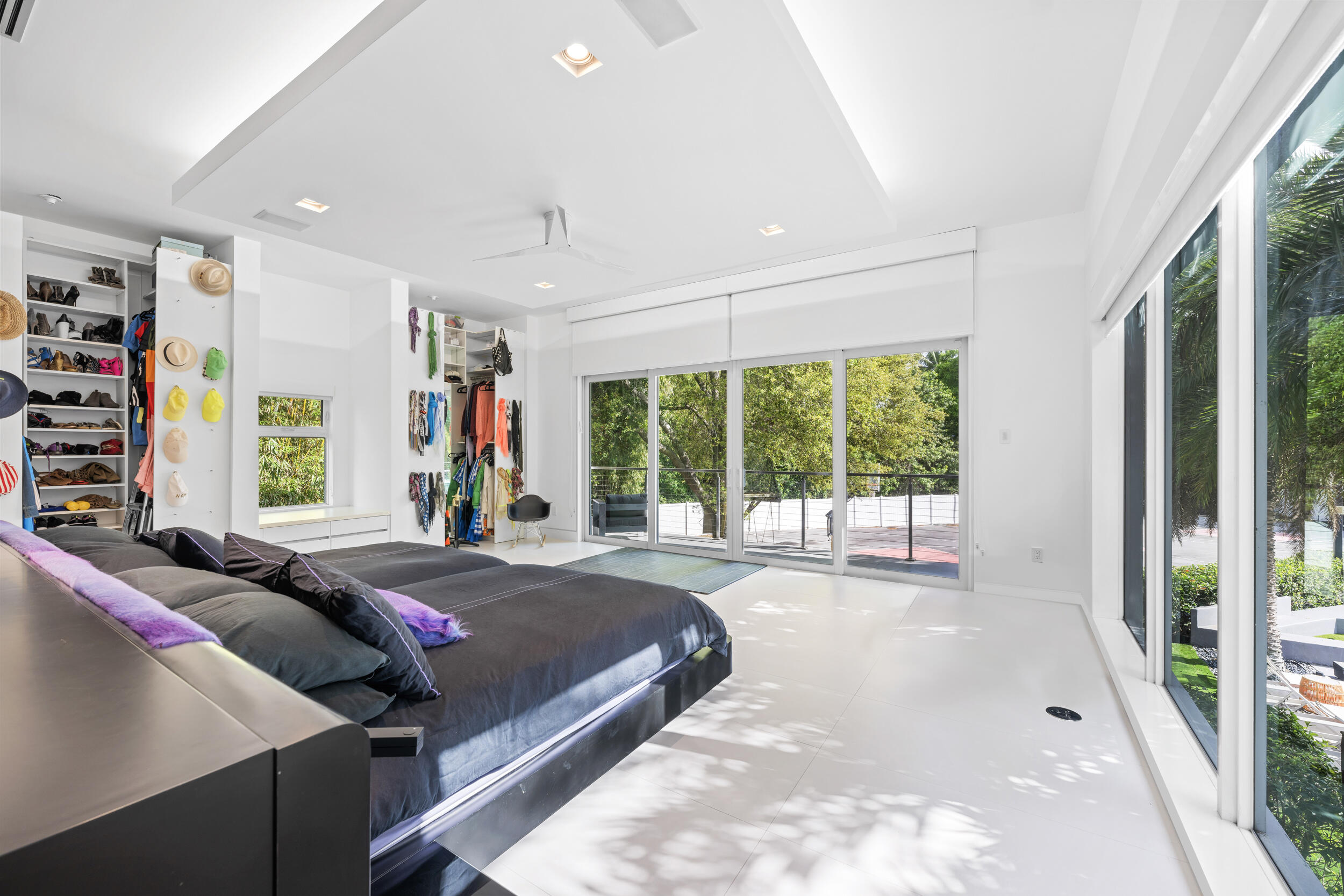 7047 San Sebastian Circle Boca Raton, FL 33433 - Photo 34 of 95 a bed sitting in a bedroom next to a window