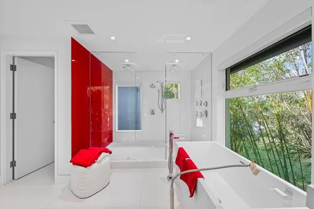 an aerial view of a house with a yard and swimming pool