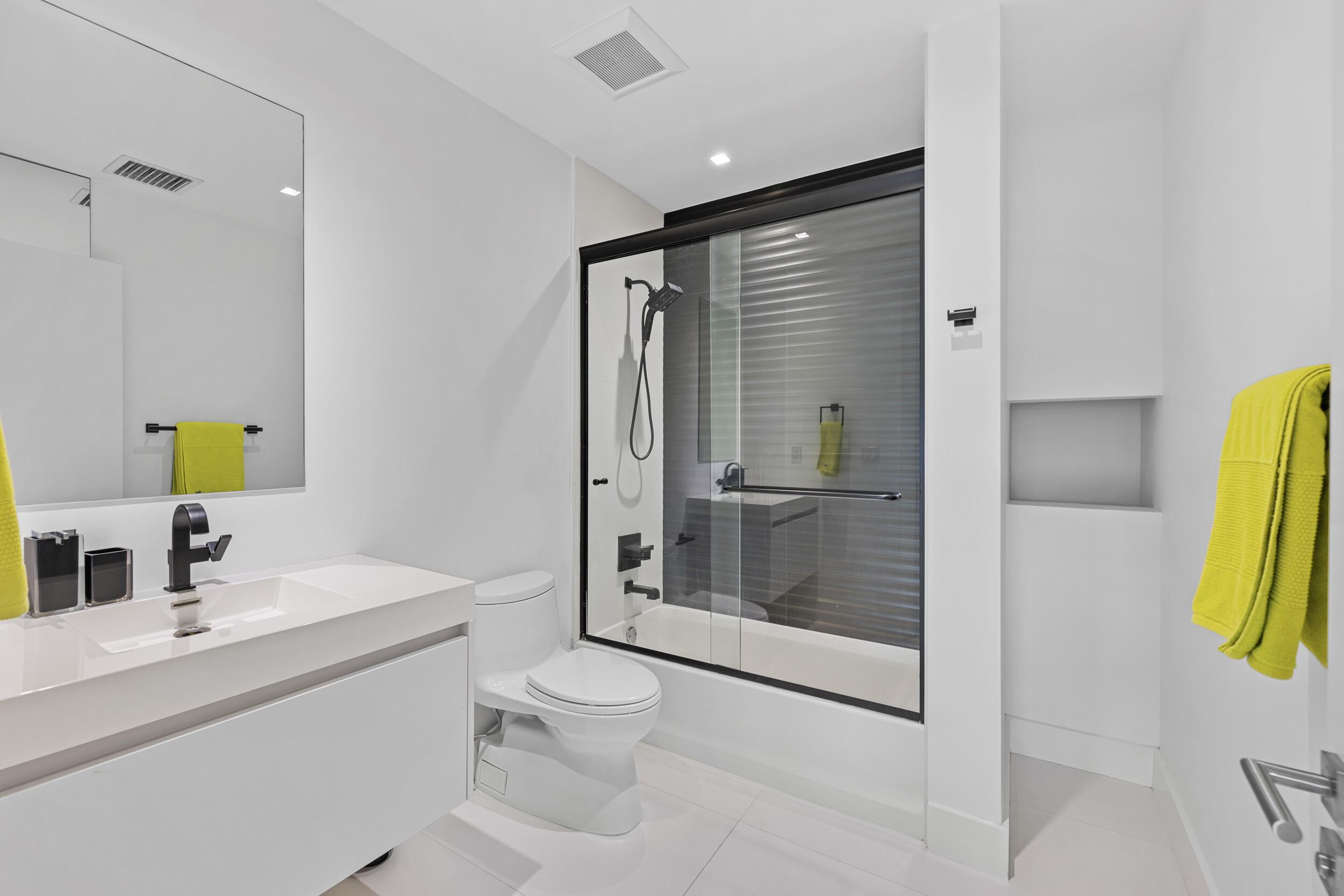 7047 San Sebastian Circle Boca Raton, FL 33433 - Photo 48 of 95 a bathroom with a shower sink and mirror