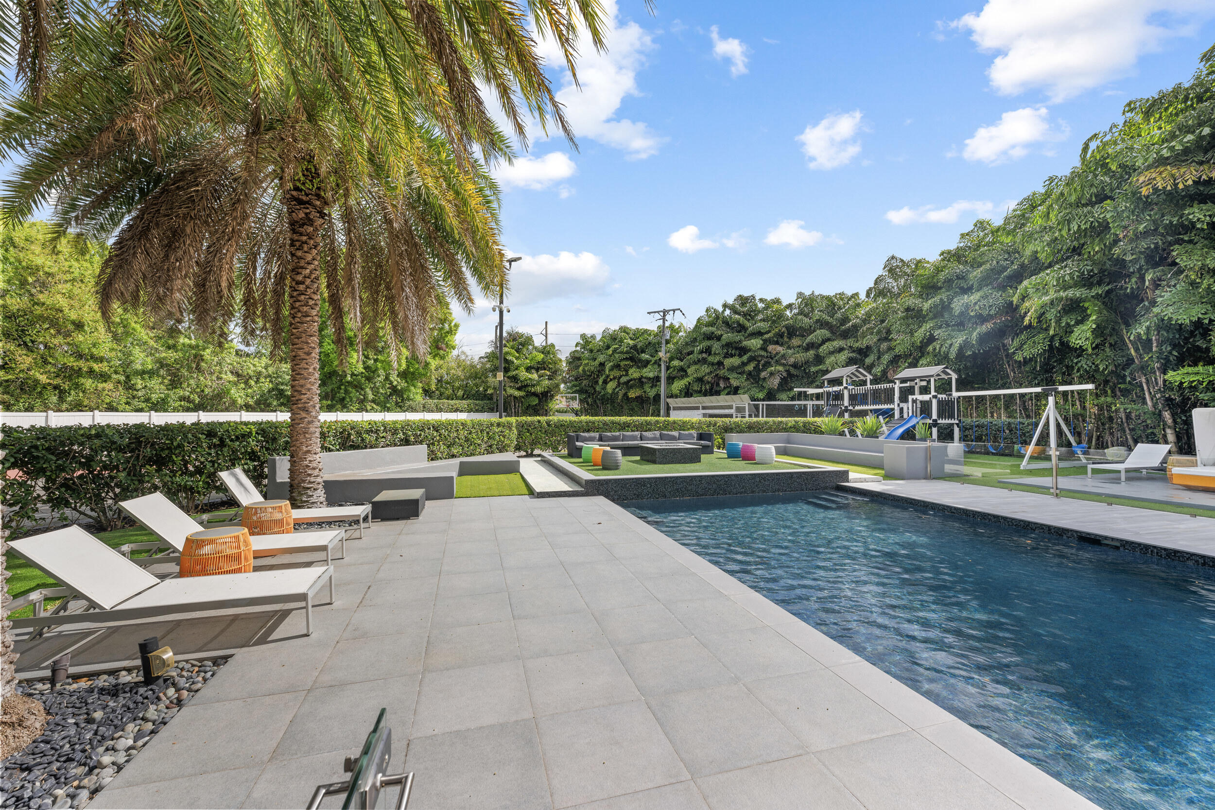 7047 San Sebastian Circle Boca Raton, FL 33433 - Photo 62 of 95 a view of swimming pool with sitting area