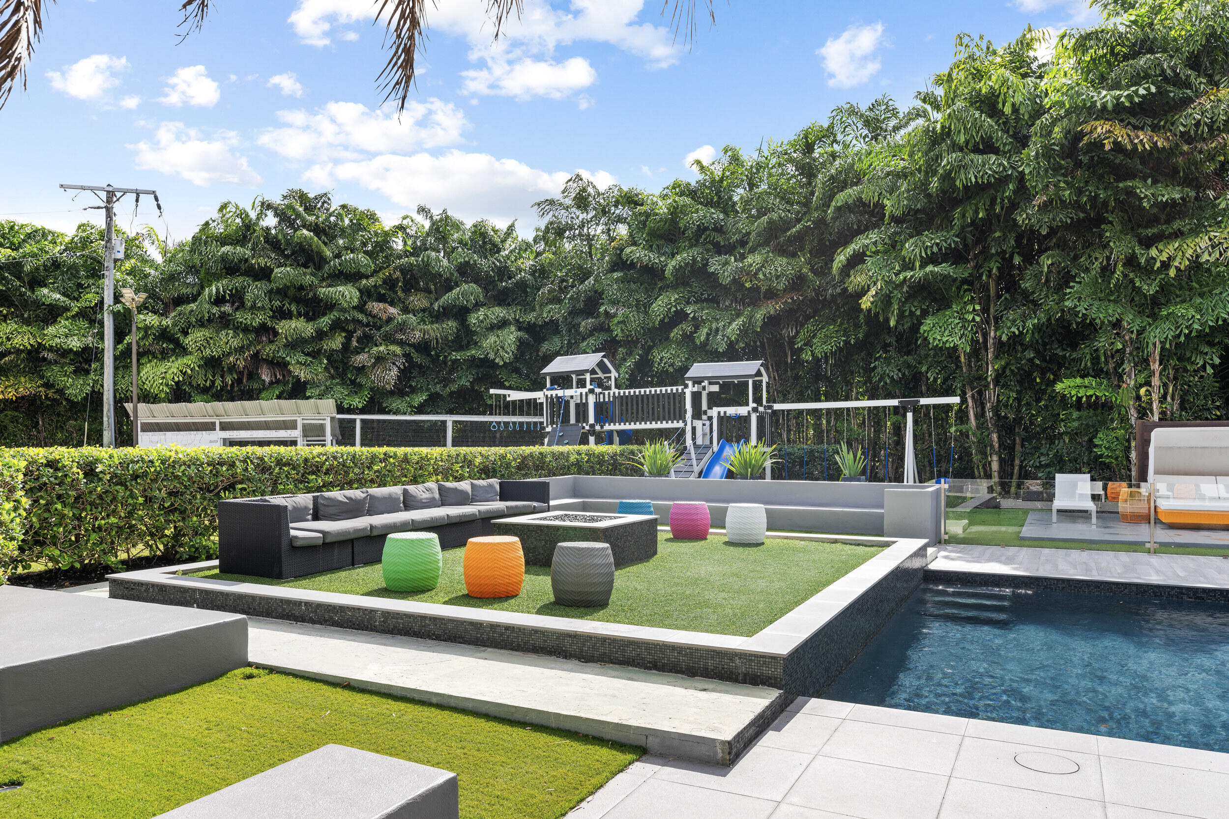 7047 San Sebastian Circle Boca Raton, FL 33433 - Photo 71 of 95 a view of a swimming pool with a patio and a yard