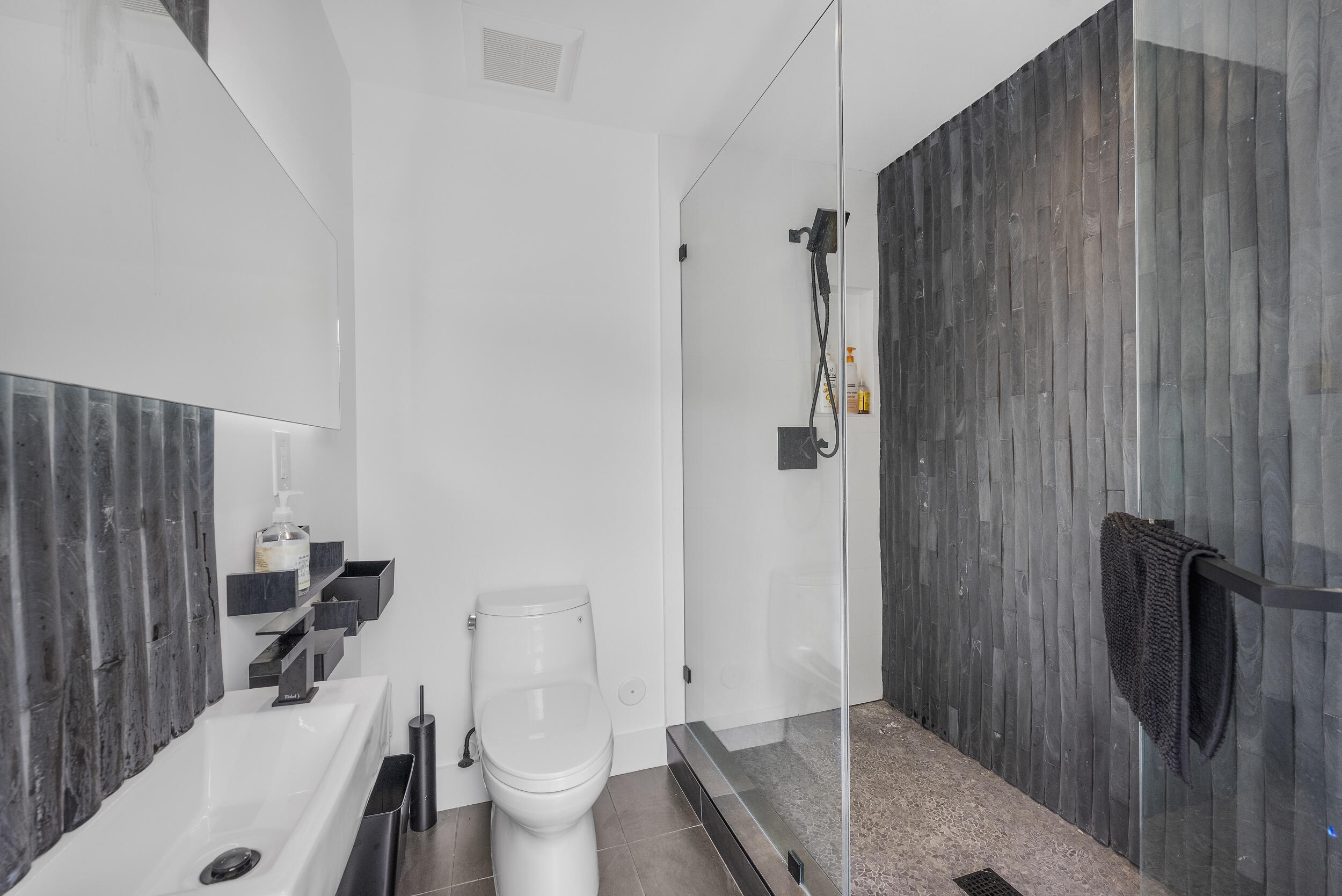 7047 San Sebastian Circle Boca Raton, FL 33433 - Photo 75 of 95 a bathroom with a sink toilet and shower