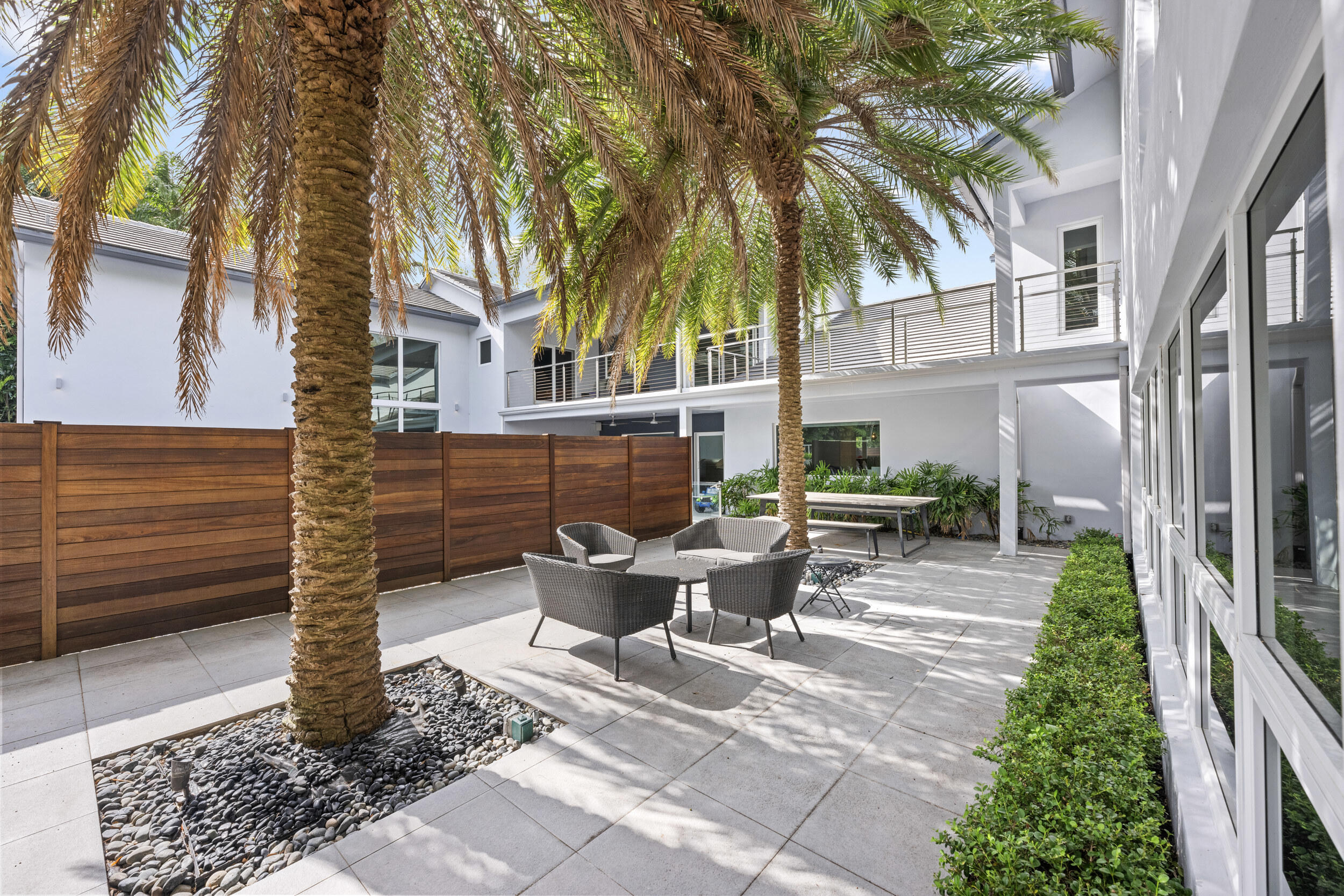 7047 San Sebastian Circle Boca Raton, FL 33433 - Photo 77 of 95 a view of backyard of house with outdoor seating and trees