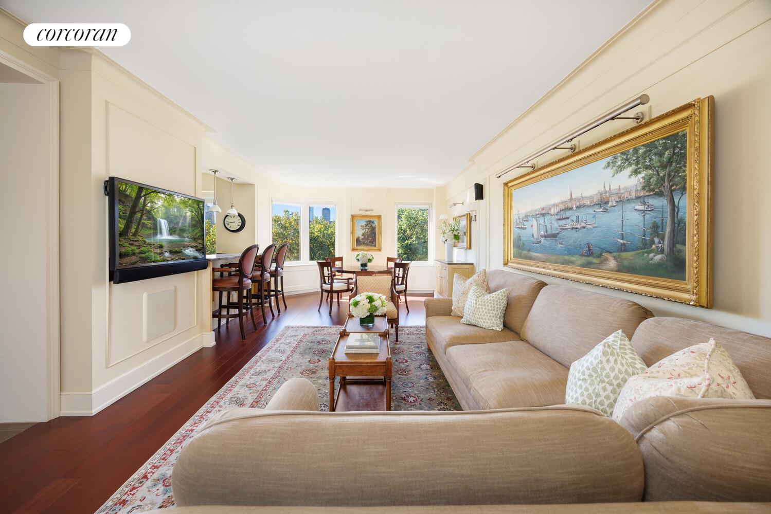 870 5th Avenue, Unit 10/11B Manhattan, NY 10065 - Photo 2 of 14 a living room with furniture and a flat screen tv