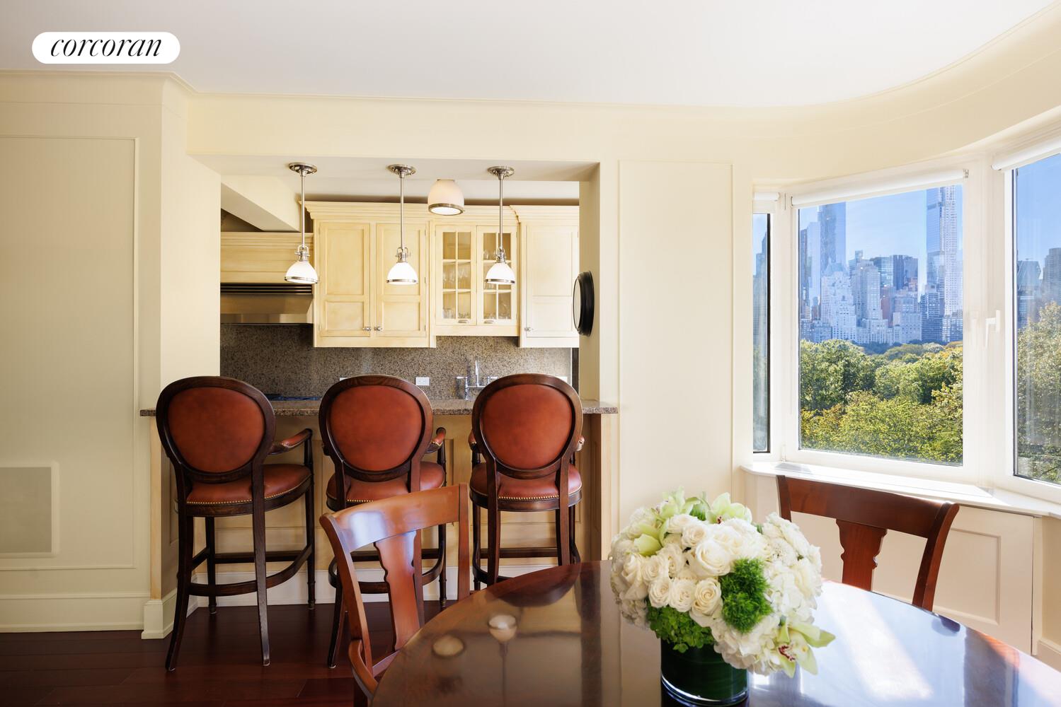 870 5th Avenue, Unit 10/11B Manhattan, NY 10065 - Photo 4 of 14 a view of a dining room with furniture window and wooden floor