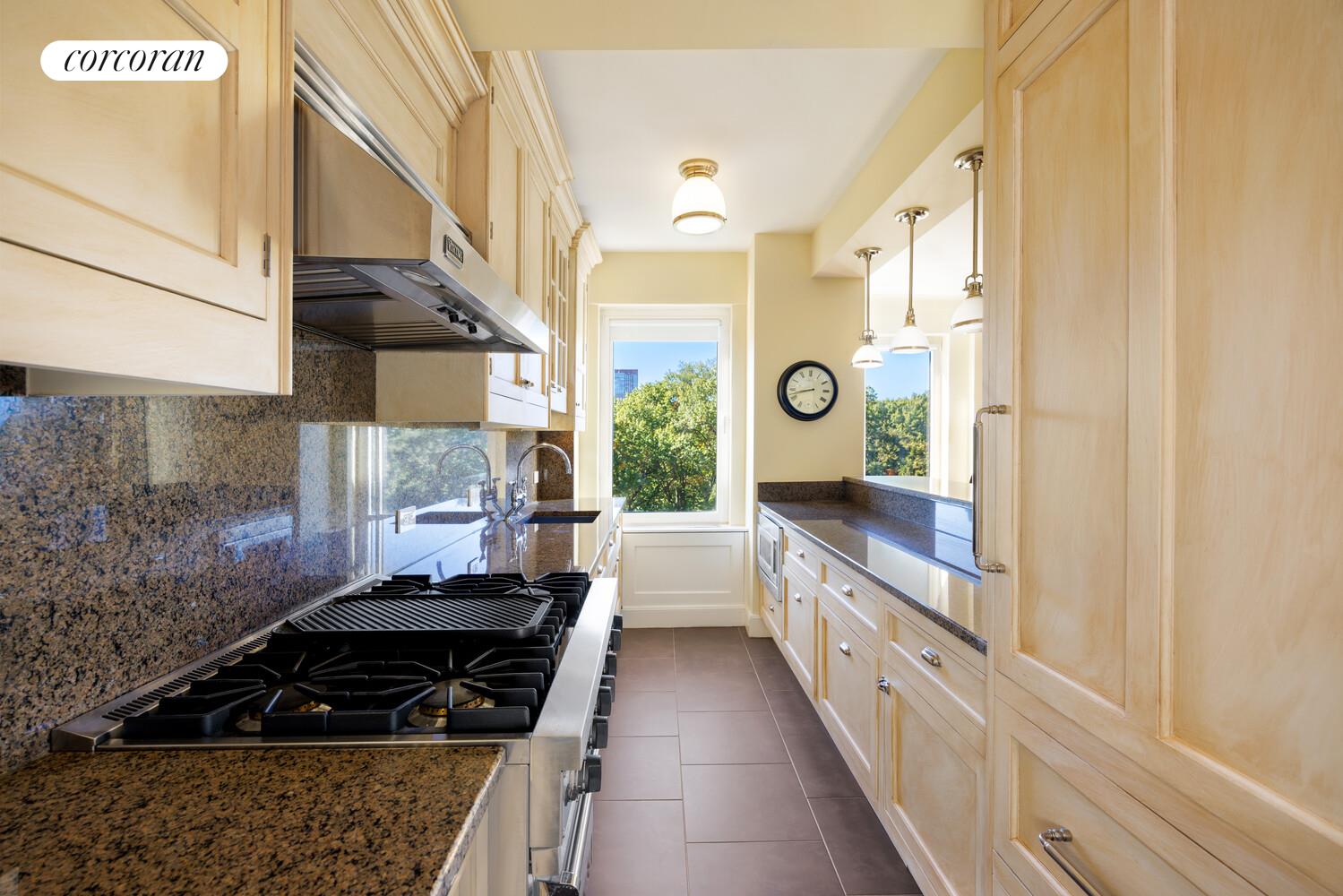 870 5th Avenue, Unit 10/11B Manhattan, NY 10065 - Photo 5 of 14 a kitchen with a sink and a stove