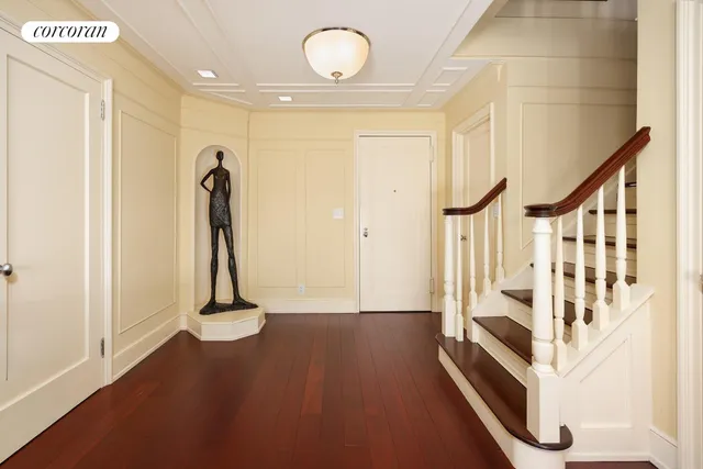a view of a room with wooden floor