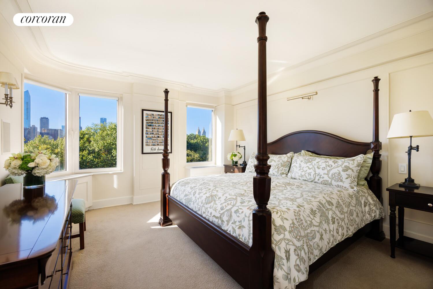 870 5th Avenue, Unit 10/11B Manhattan, NY 10065 - Photo 8 of 14 a bedroom with a large bed and a potted plant